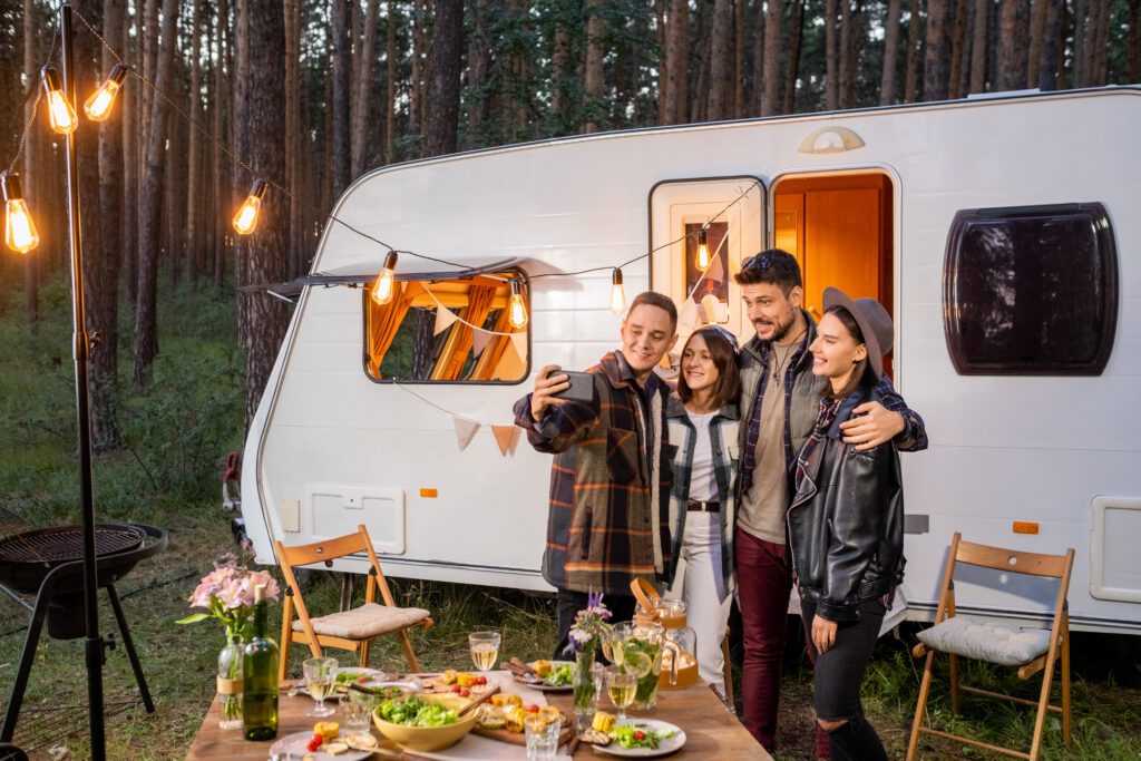 Group of happy young friends making selfie by mobile house